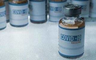 vaccine covid 19 in bottle for medical content. photo