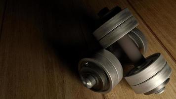 dumbbells  wood floor dark tone 3d rendering for fitnesses content. photo