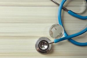 stethoscopes on wood background image close up photo