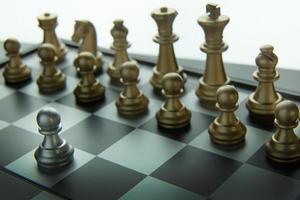 gold and silver chess on board close up image abstract Background. photo