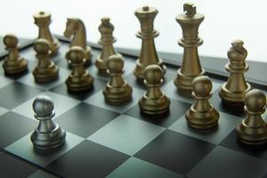 gold and silver chess on board close up image abstract Background. photo