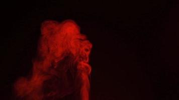 Slow motion of red smoke, fog, mist, vapor on a black background. video