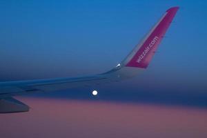 Wing in the sky WizzAir plane. Selective focus. Warsaw, Poland. 20.10.2019 photo