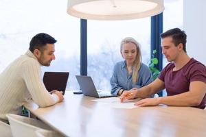 Startup Business Team At A Meeting at modern office building photo