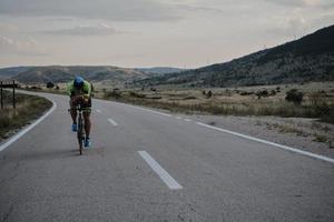triathlon athlete riding bike photo