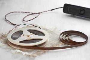 Audio magnetic recording tape spools on white wooden table. photo