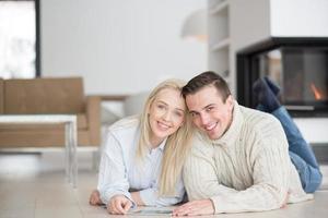 Young Couple using digital tablet on cold winter day photo
