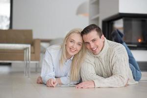 Young Couple using digital tablet on cold winter day photo