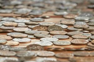 Close up side view image of large amount of coins. photo