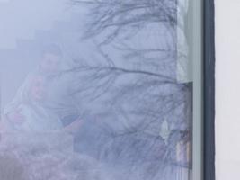 Couple using digital tablet on cold winter day photo