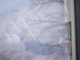 Couple using digital tablet on cold winter day photo