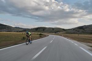 triathlon athlete riding bike photo