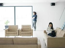 multiethnic couple at home using tablet computers photo