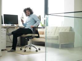 man using a mobile phone  at home photo