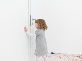 Little girl standing on confetti photo