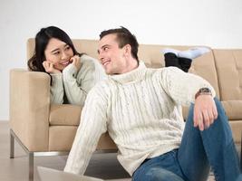 happy multiethnic couple relaxing at home photo