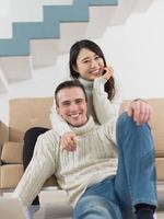 happy multiethnic couple relaxing at home photo