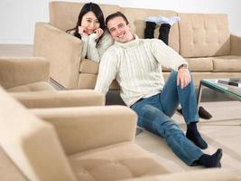 happy multiethnic couple relaxing at home photo