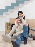 happy multiethnic couple relaxing at home photo