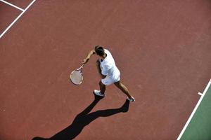 young man play tennis photo