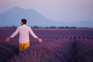 man in lavender flower field photo