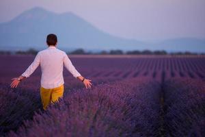 man in lavender flower field photo