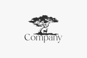 Elegant tree logo with a deer underneath for any business. vector