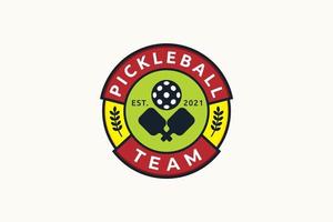 pickleball team logo with combination a ball and paddles vector