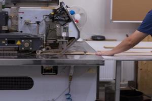 engineer in front of wood cutting machine photo