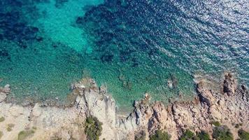 A bird's eye view of a stunning nature reserve, with rocky outcrops, coral reefs and lush vegetation. video