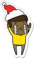 sticker cartoon of a man crying wearing santa hat vector