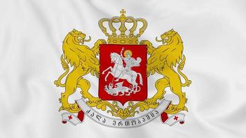 escudo de armas del emblema nacional o símbolo de georgia en bandera ondeante. Bucle suave de video 4k sin problemas