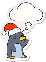 cute cartoon christmas penguin and thought bubble as a printed sticker vector