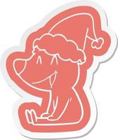 sitting bear cartoon  sticker of a wearing santa hat vector