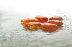 isolated wet zen stones with splashing  water drops photo