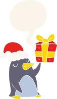 cartoon penguin and christmas present and speech bubble in retro style vector