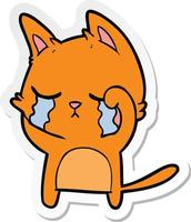 sticker of a crying cartoon cat vector