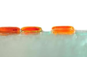 isolated wet zen stones with splashing  water drops photo