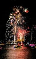 fireworks on the river in the dark sky photo