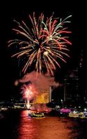 fireworks on the river in the dark sky photo