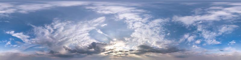 Seamless hdri panorama 360 degrees angle view blue evening sky with beautiful clouds before sunset with zenith for use in 3d graphics or game development as sky dome or edit drone shot photo