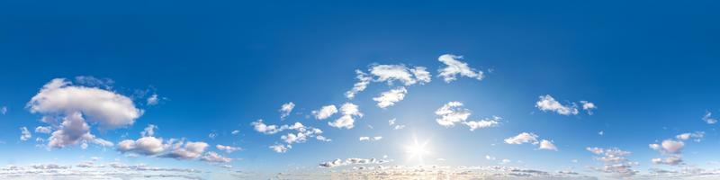 Seamless hdri panorama 360 degrees angle view blue sky with beautiful fluffy cumulus clouds with zenith for use in 3d graphics or game development as sky dome or edit drone shot photo