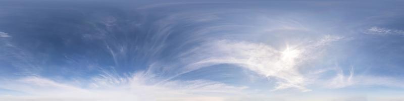 blue sky with beautiful fluffy cumulus clouds. Seamless hdri panorama 360 degrees angle view without ground for use in 3d graphics or game development as sky dome or edit drone shot photo