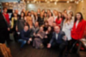 Master class and study concept. Abstract blurred group photo of peoples from conference or seminar room.