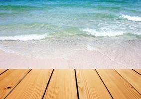 Empty wooden deck table over sea background, Summer concept photo