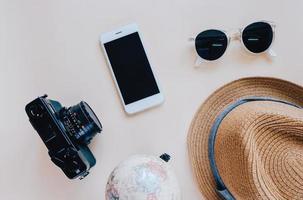 Flat lay of travel items and accessories in minimal style photo