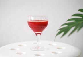 Cold pressed juice of beetroot in glass for healthy drink with vitamin and antioxidant, vegan lifestyle photo