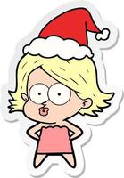 sticker cartoon of a girl pouting wearing santa hat vector