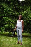 African american woman outdoor with rosary on hand. Concept for Faith, Spirituality and Religion. photo