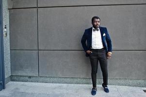 Handsome fashionable african american man in formal wear and bow tie. photo